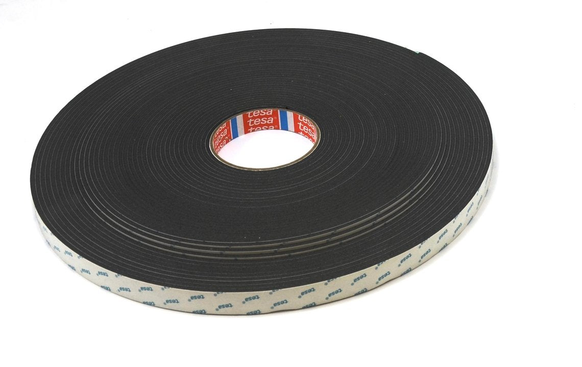 A roll of grey foam tape with a label in the center.