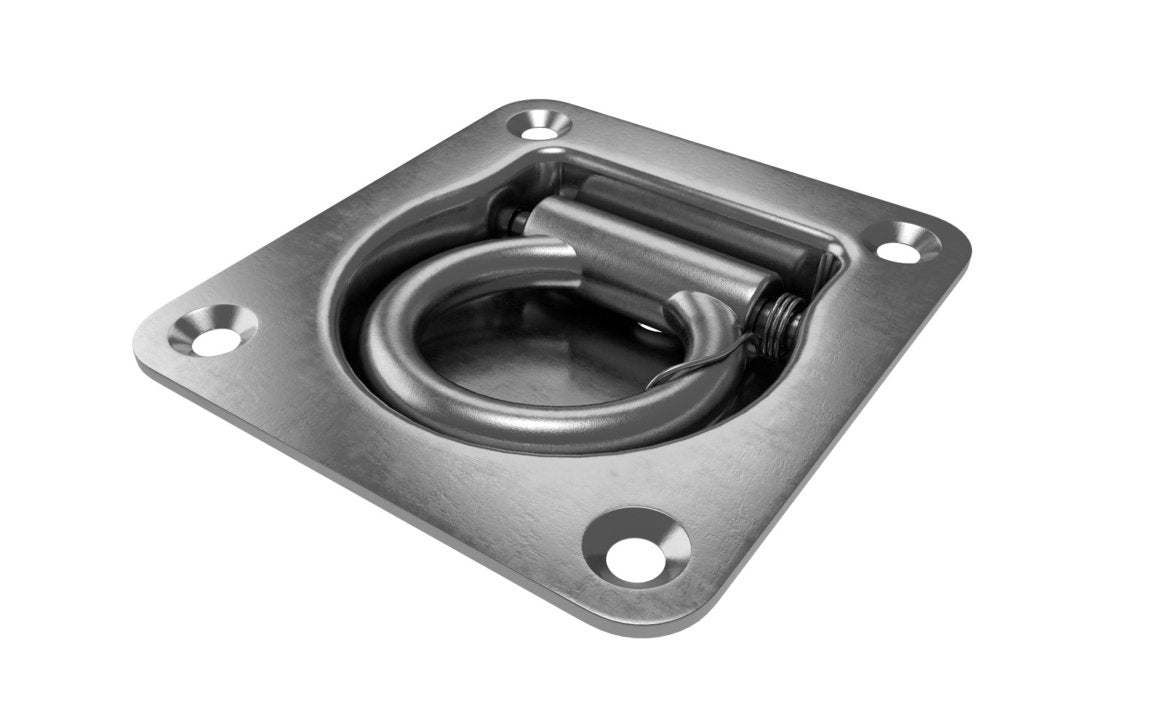 A zinc plated, mild steel lashing ring with a recessed design mounted on a flat surface.